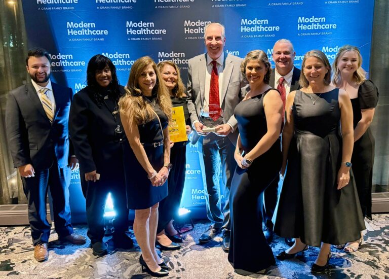 Team members from iMPROve Health celebrating their achievements at the Modern Healthcare Awards gala.