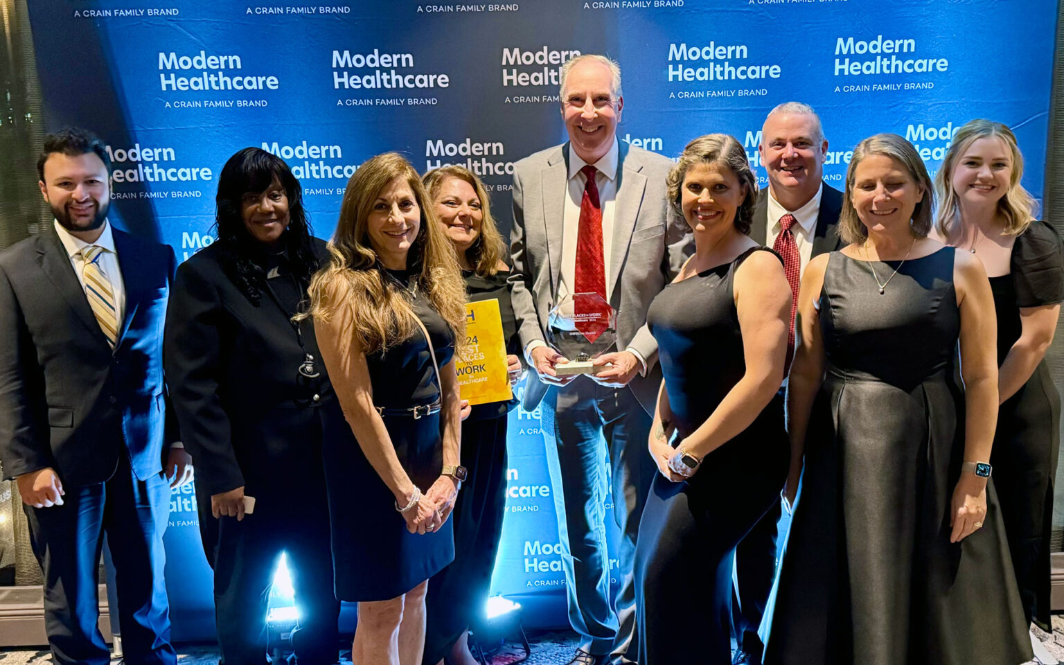 Team members from iMPROve Health celebrating their achievements at the Modern Healthcare Awards gala.