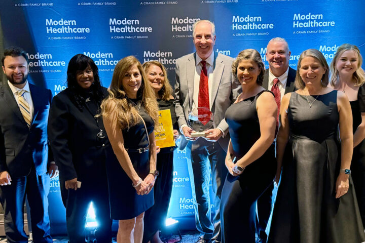 Team members from iMPROve Health celebrating their achievements at the Modern Healthcare Awards gala.