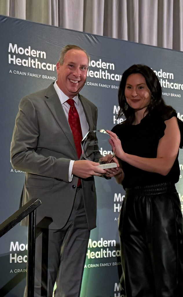 Leland Babitch accepting iMPROve Health's Modern Healthcare award.